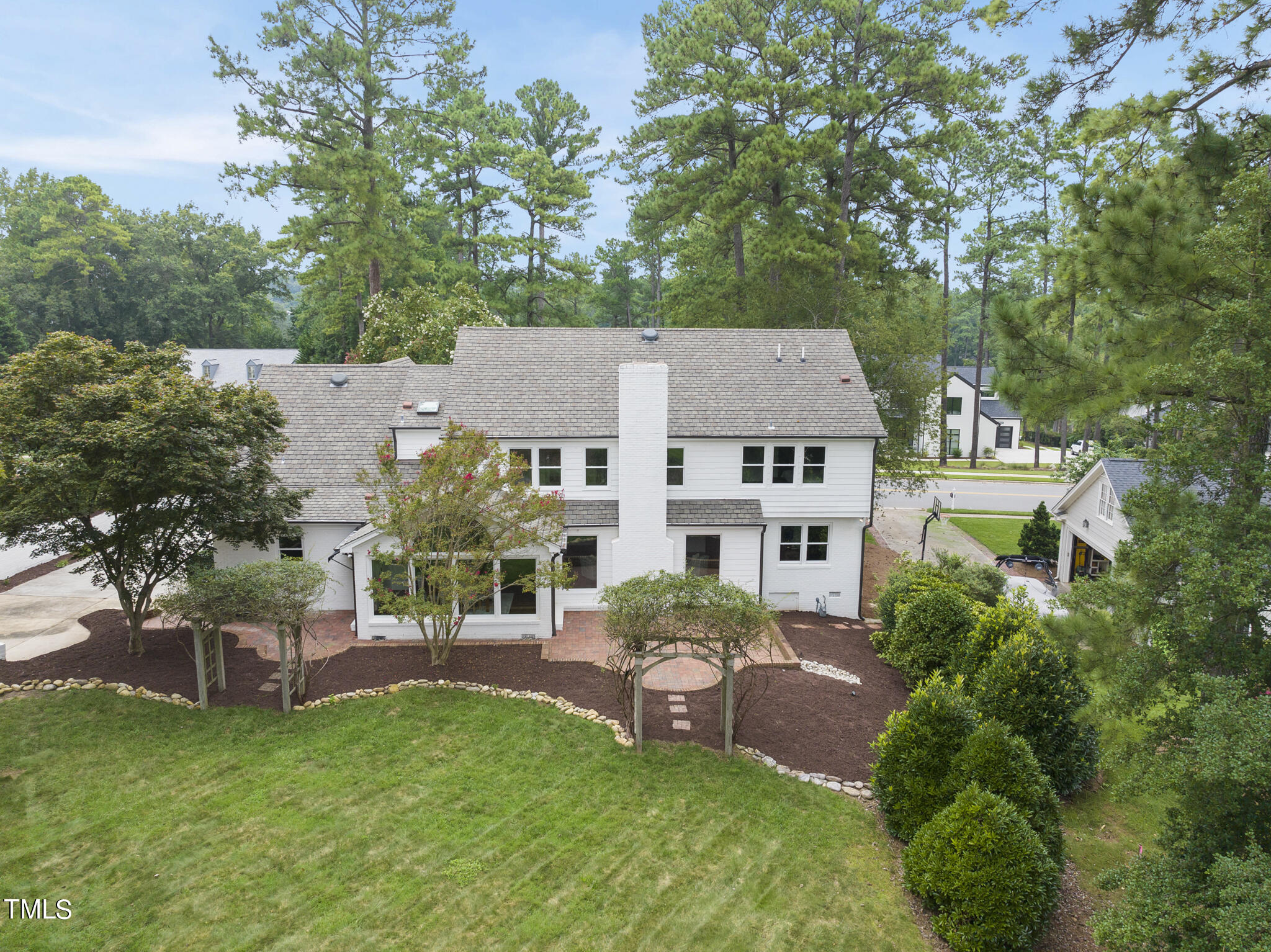 1704 Hunting Ridge Road Raleigh, NC 27615 - Photo 4 of 46 aerial view of a house with a garden and plants