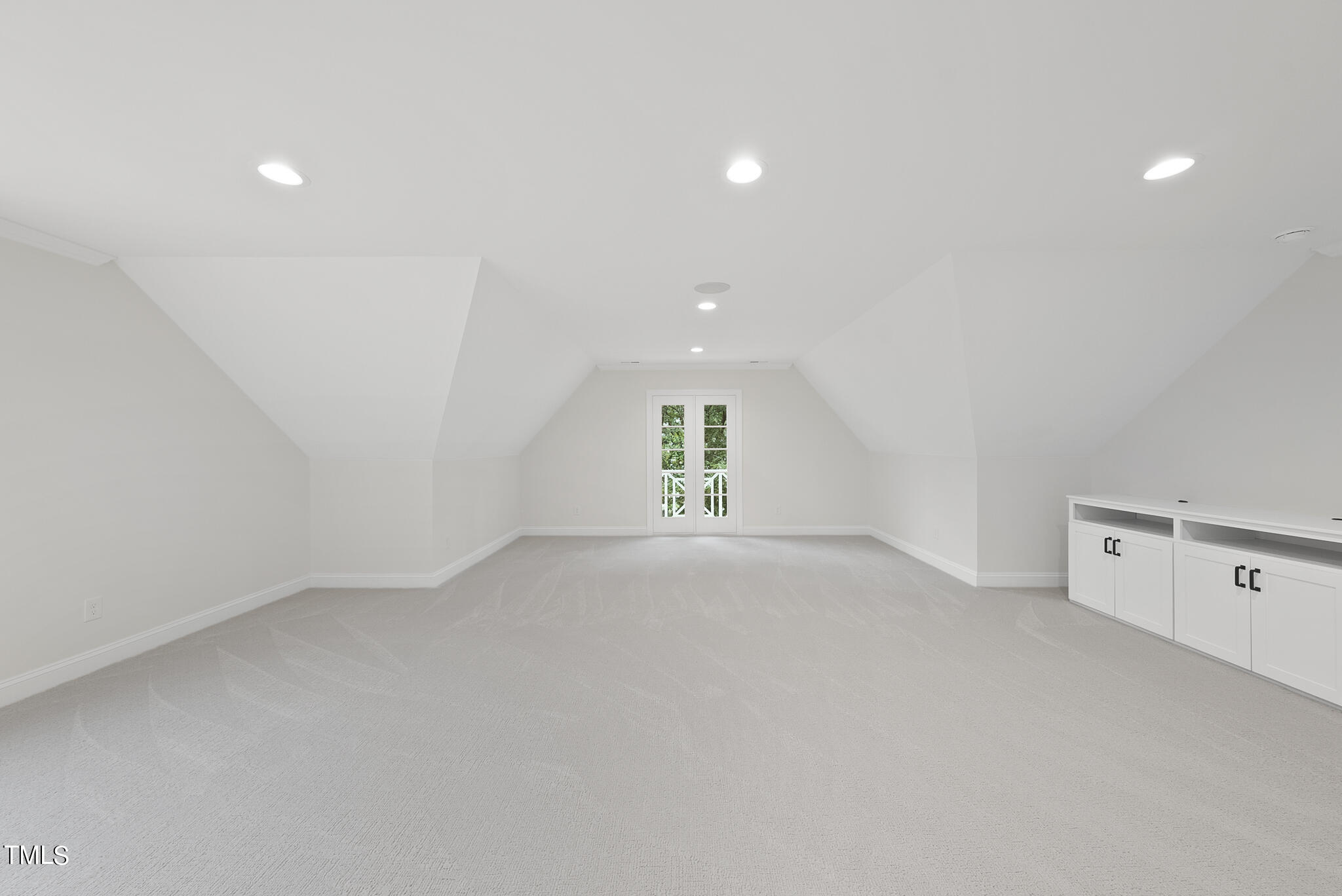 1704 Hunting Ridge Road Raleigh, NC 27615 - Photo 41 of 46 an empty room with windows and window
