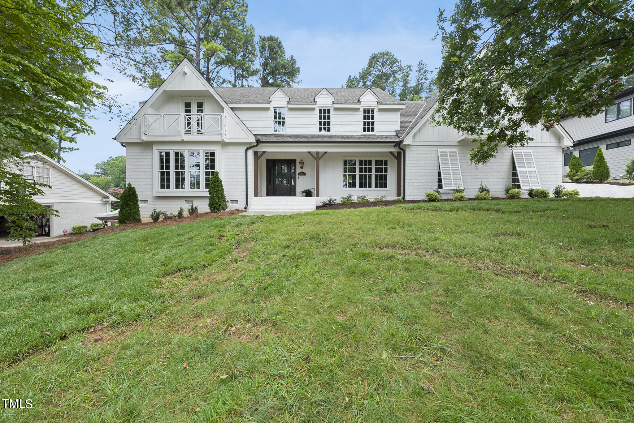 1704 Hunting Ridge Road Raleigh, NC 27615 - Photo 46 of 46 a front view of a house with a garden
