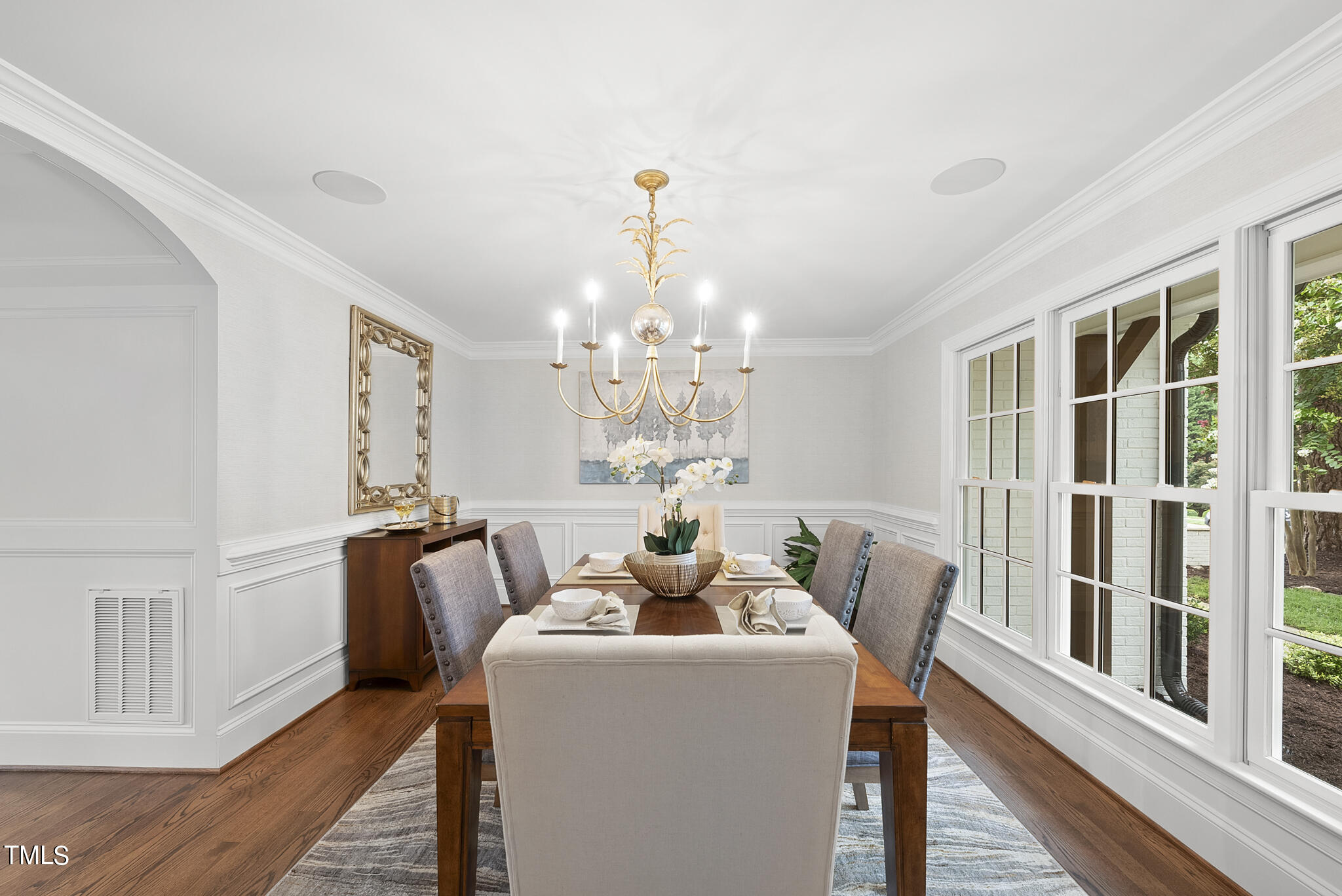 1704 Hunting Ridge Road Raleigh, NC 27615 - Photo 10 of 46 a dining room with furniture a livingroom and chandelier
