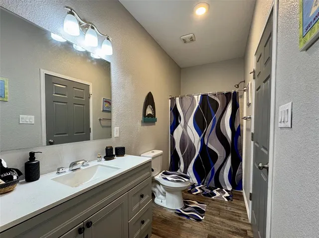 a view of walk in closet with clothes