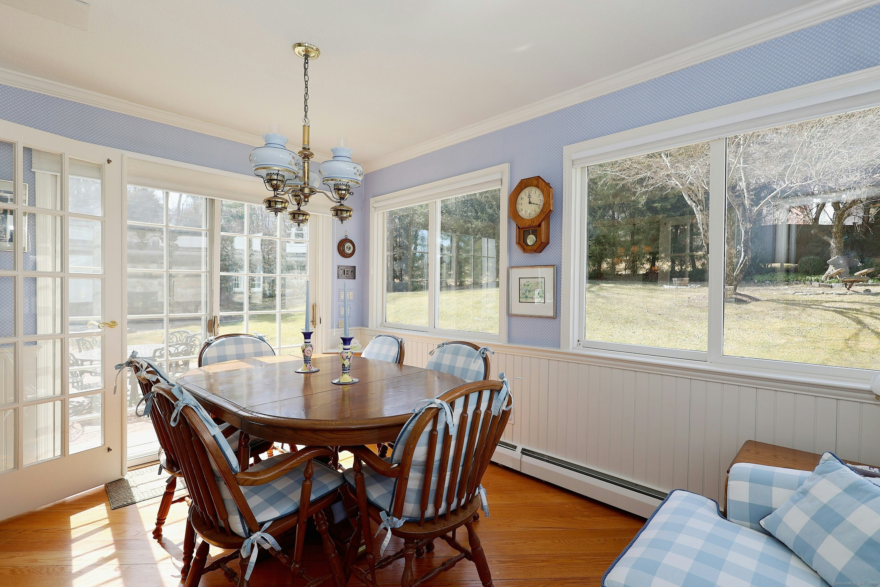 463 North Salem Road Ridgefield, CT 06877 - Photo 12 of 40 a dining room with furniture a chandelier and wooden floor