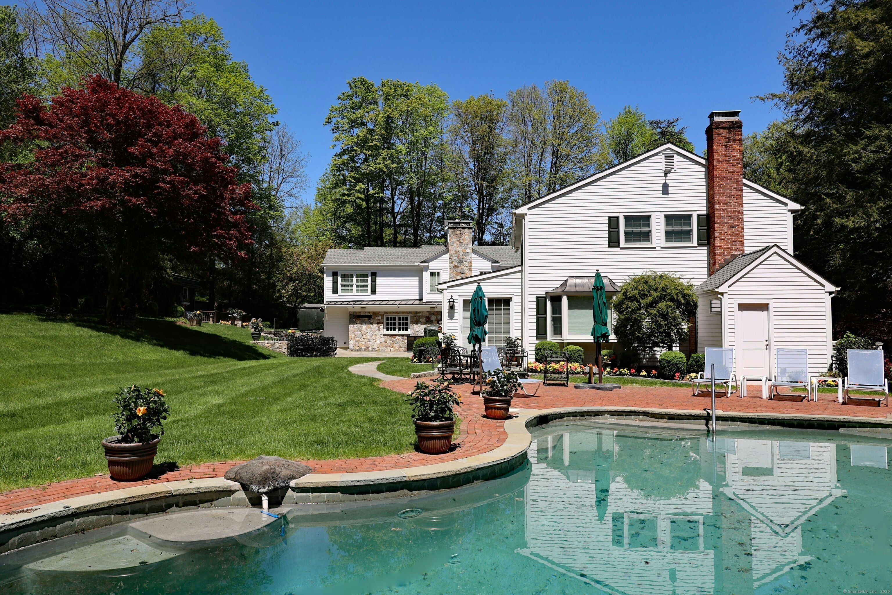 463 North Salem Road Ridgefield, CT 06877 - Photo 3 of 40 a house view with swimming pool and outdoor seating