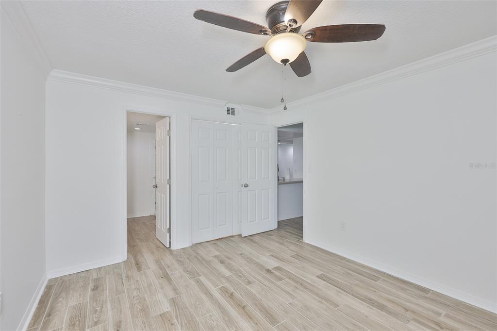 4736 Jasper Drive, Unit 103 New Port Richey, FL 34652 - Photo 20 of 41 wooden floor in an empty room with a window
