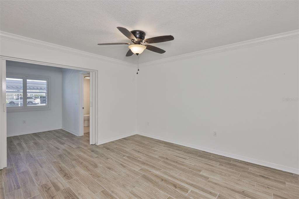 4736 Jasper Drive, Unit 103 New Port Richey, FL 34652 - Photo 24 of 41 a view of empty room with wooden floor