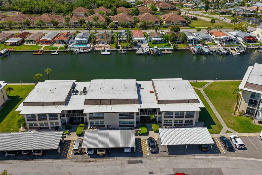 4736 Jasper Drive, Unit 103 New Port Richey, FL 34652 - Photo 31 of 41 an aerial view of a house with a lake view