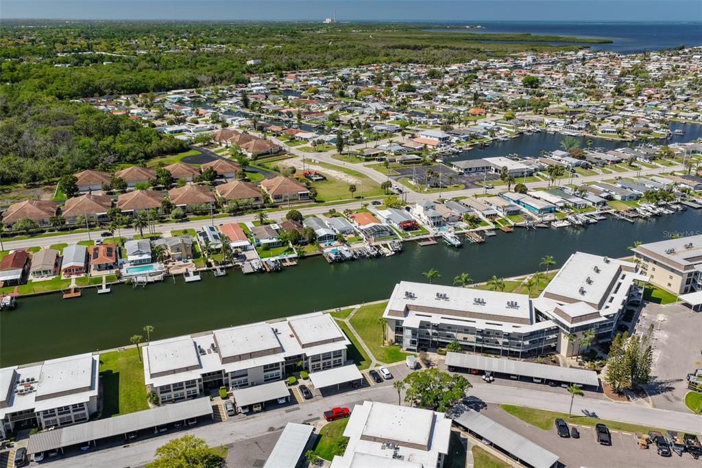 4736 Jasper Drive, Unit 103 New Port Richey, FL 34652 - Photo 32 of 41 an aerial view of a houses with a lake