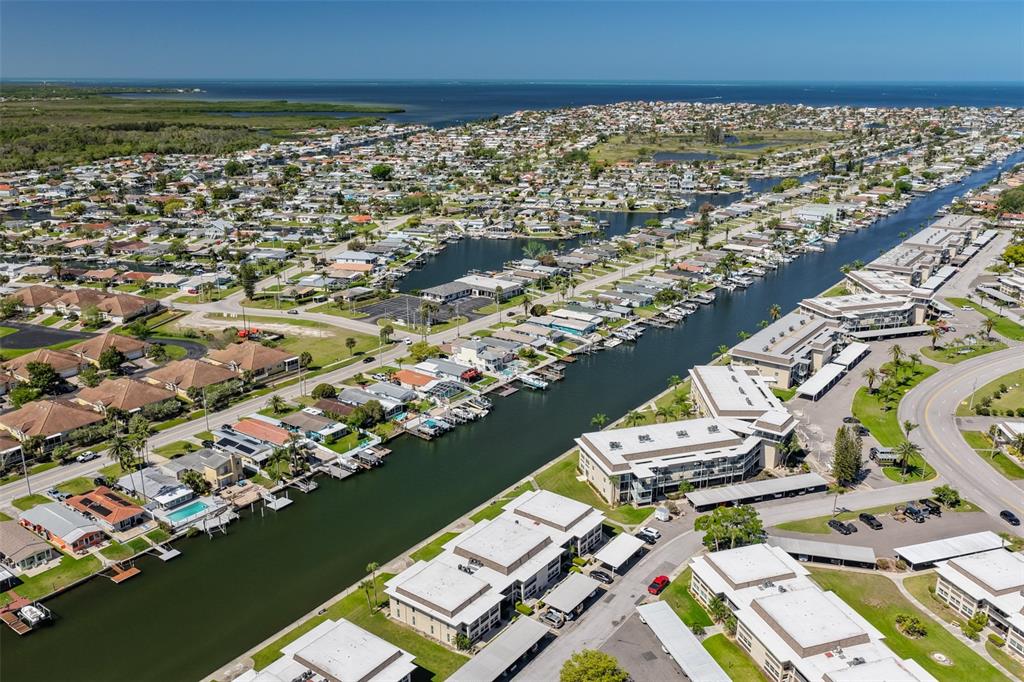 4736 Jasper Drive, Unit 103 New Port Richey, FL 34652 - Photo 33 of 41 an aerial view of residential houses with outdoor space