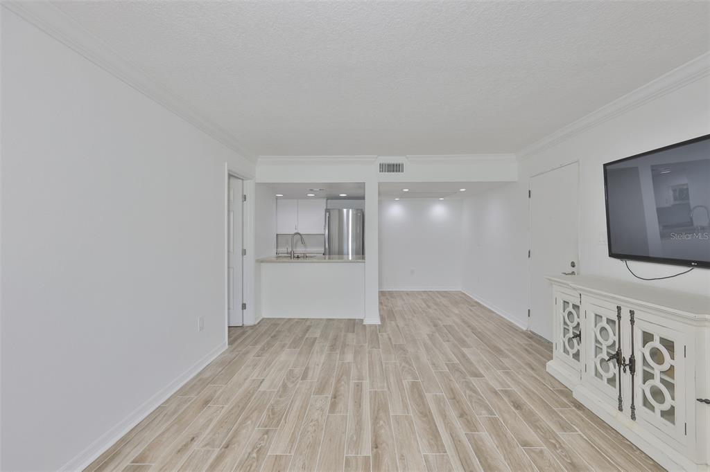 4736 Jasper Drive, Unit 103 New Port Richey, FL 34652 - Photo 7 of 41 a view of a livingroom with wooden floor