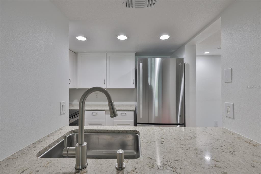 4736 Jasper Drive, Unit 103 New Port Richey, FL 34652 - Photo 10 of 41 a view of a livingroom with sink
