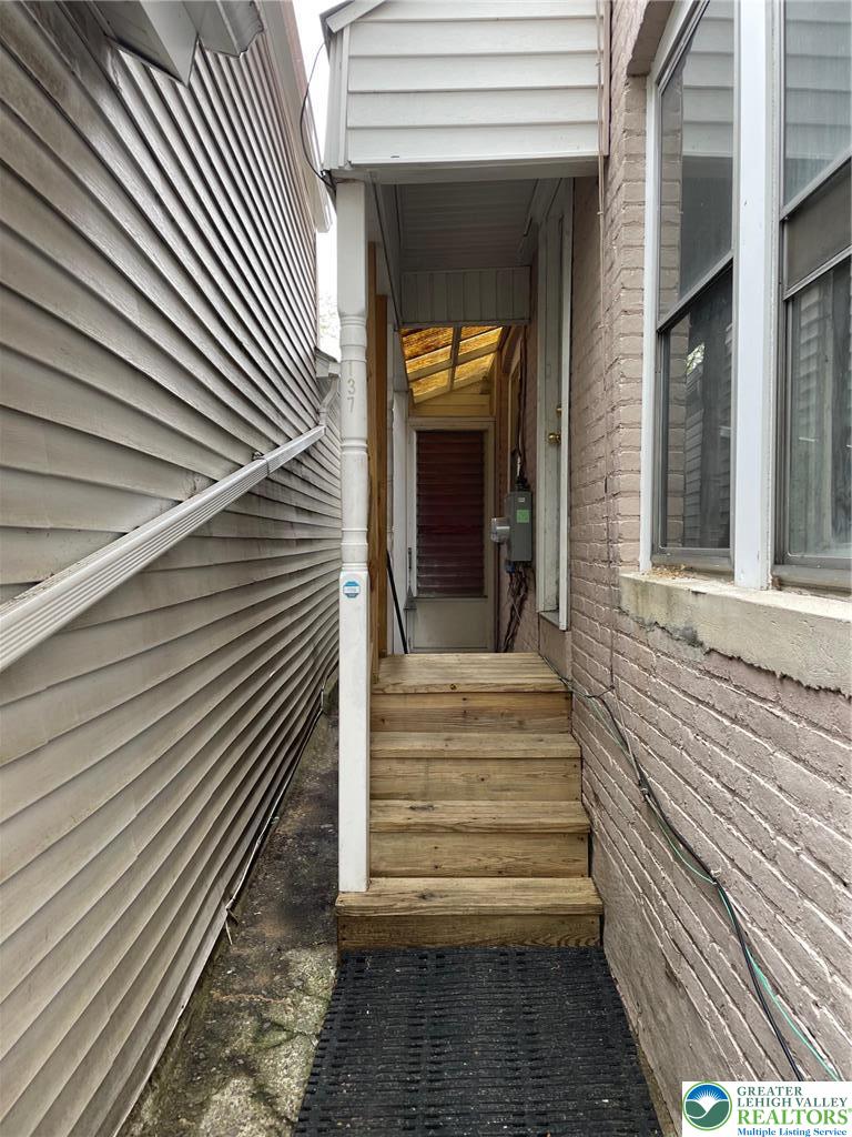 137 South 17th Street Wilson, PA 18042 - Photo 2 of 14 a view of a pathway of a house with a door and wooden floor