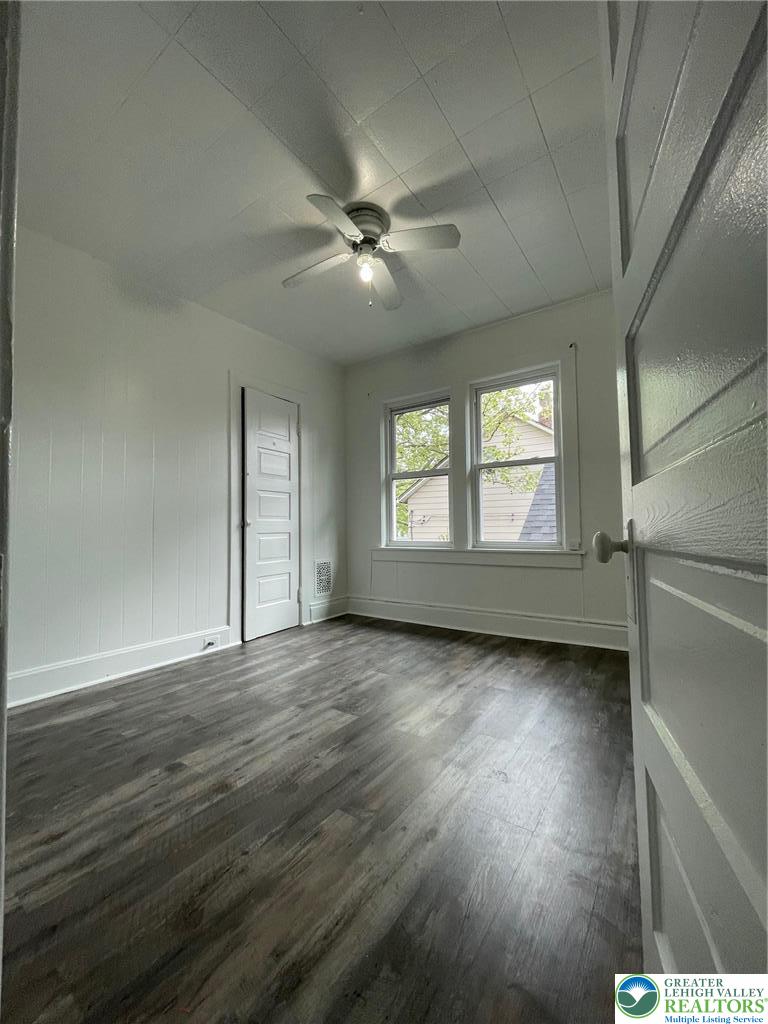 137 South 17th Street Wilson, PA 18042 - Photo 4 of 14 a view of an empty room with wooden floor and window