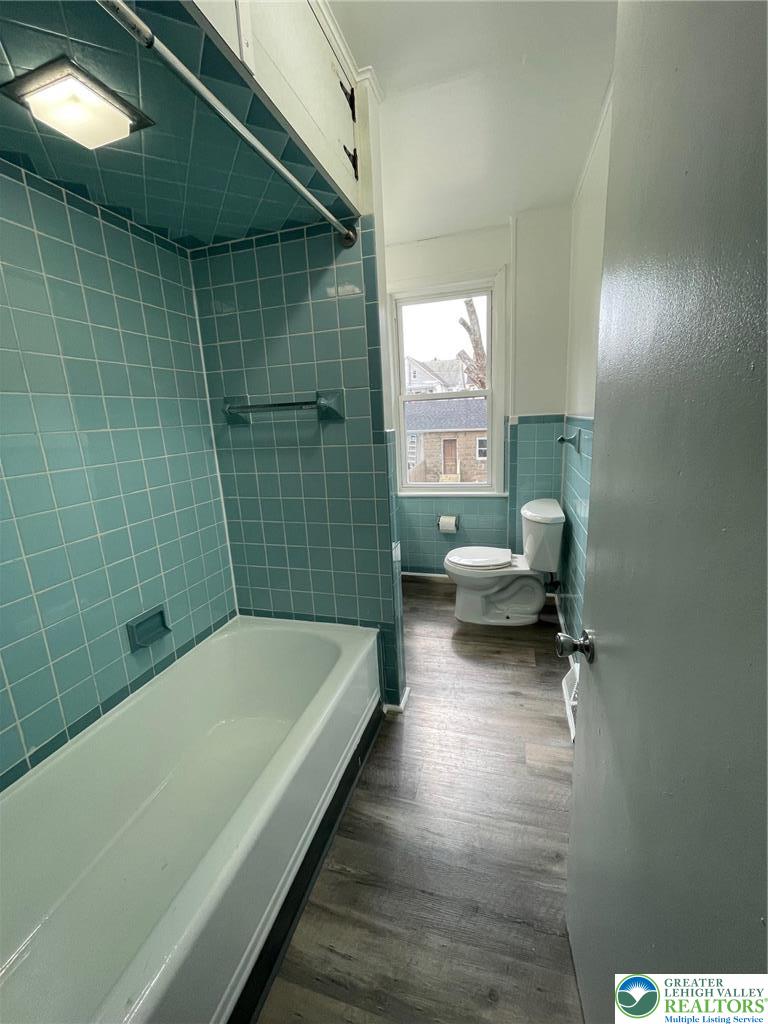 137 South 17th Street Wilson, PA 18042 - Photo 10 of 14 a bathroom with a tub and a shower