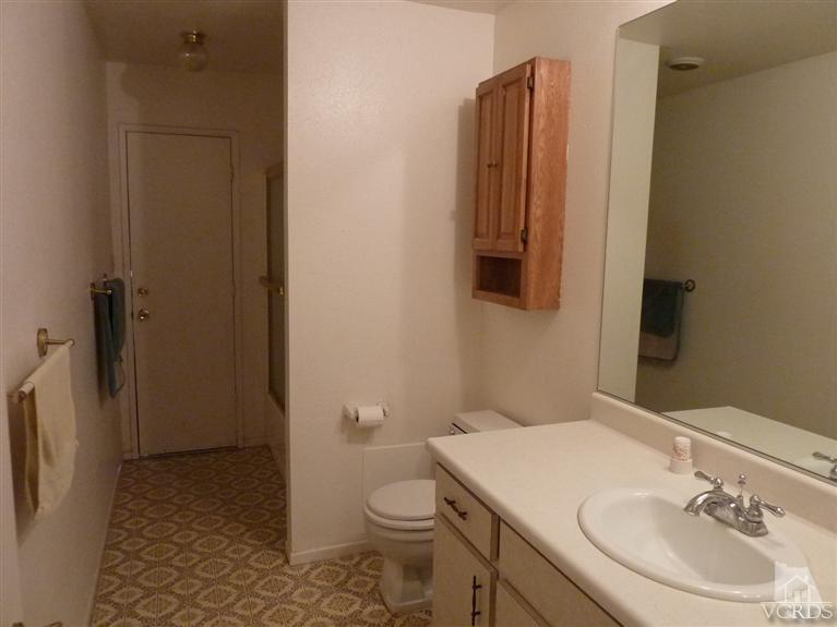 4593 Adam Road Simi Valley, CA 93063 - Photo 12 of 27 a bathroom with a sink a toilet and shower