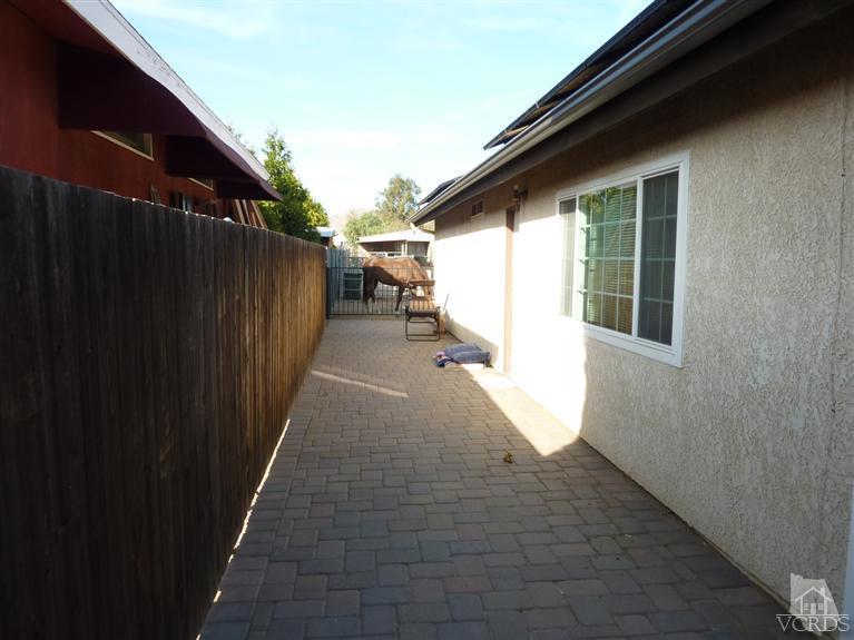 4593 Adam Road Simi Valley, CA 93063 - Photo 22 of 27 a view of a house with a backyard