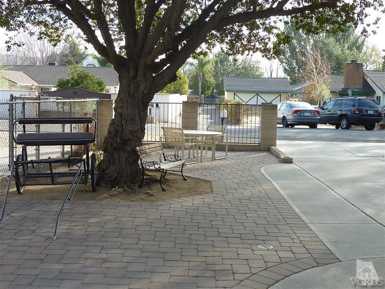4593 Adam Road Simi Valley, CA 93063 - Photo 23 of 27 a row of table and chairs in a patio