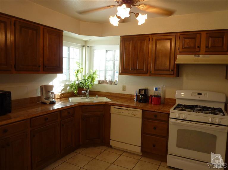 4593 Adam Road Simi Valley, CA 93063 - Photo 7 of 27 a kitchen with a sink cabinets and window