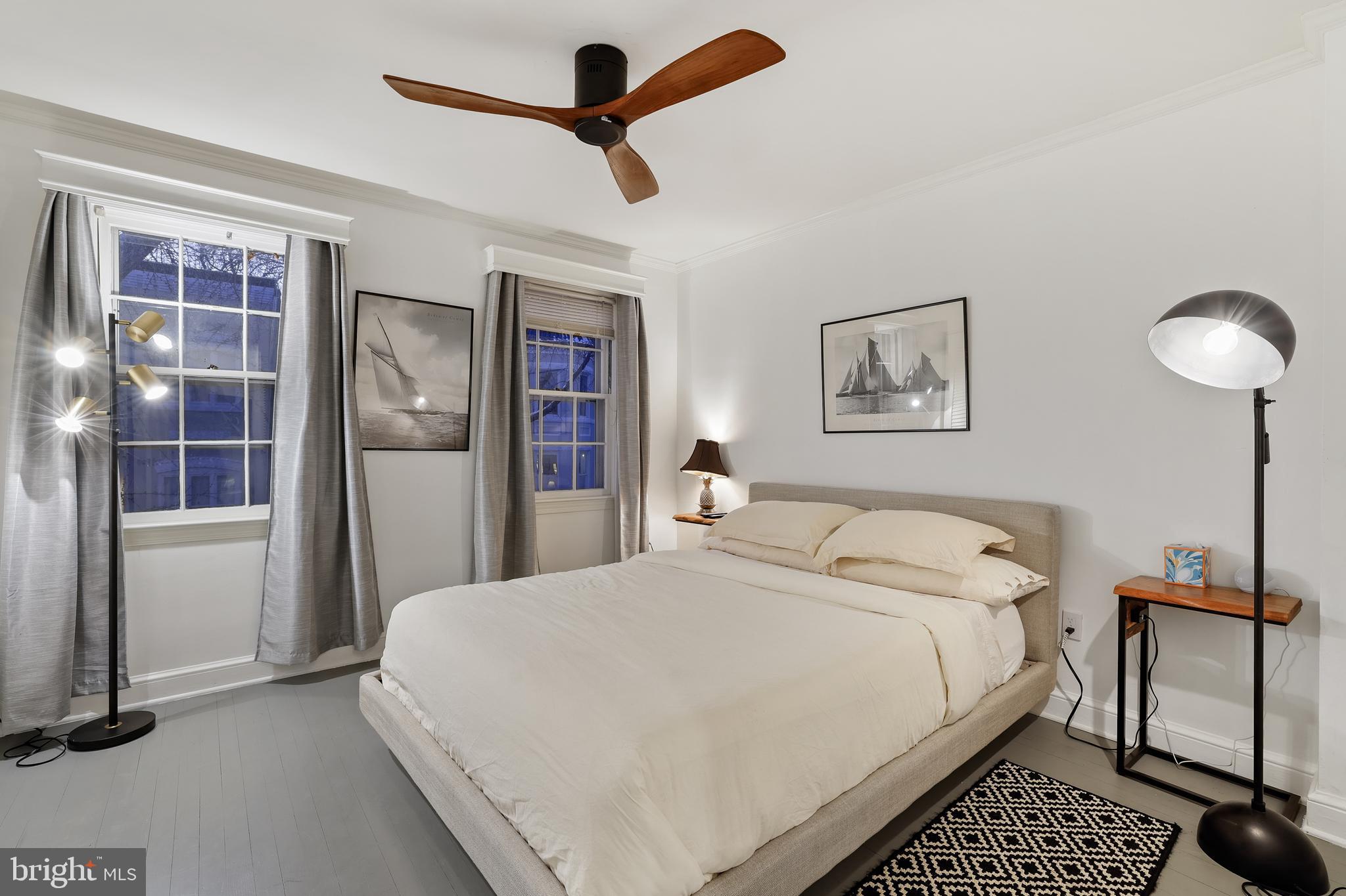 1233 Potomac Street Northwest Washington, DC 20007 - Photo 13 of 26 a bedroom with a large bed and a chandelier