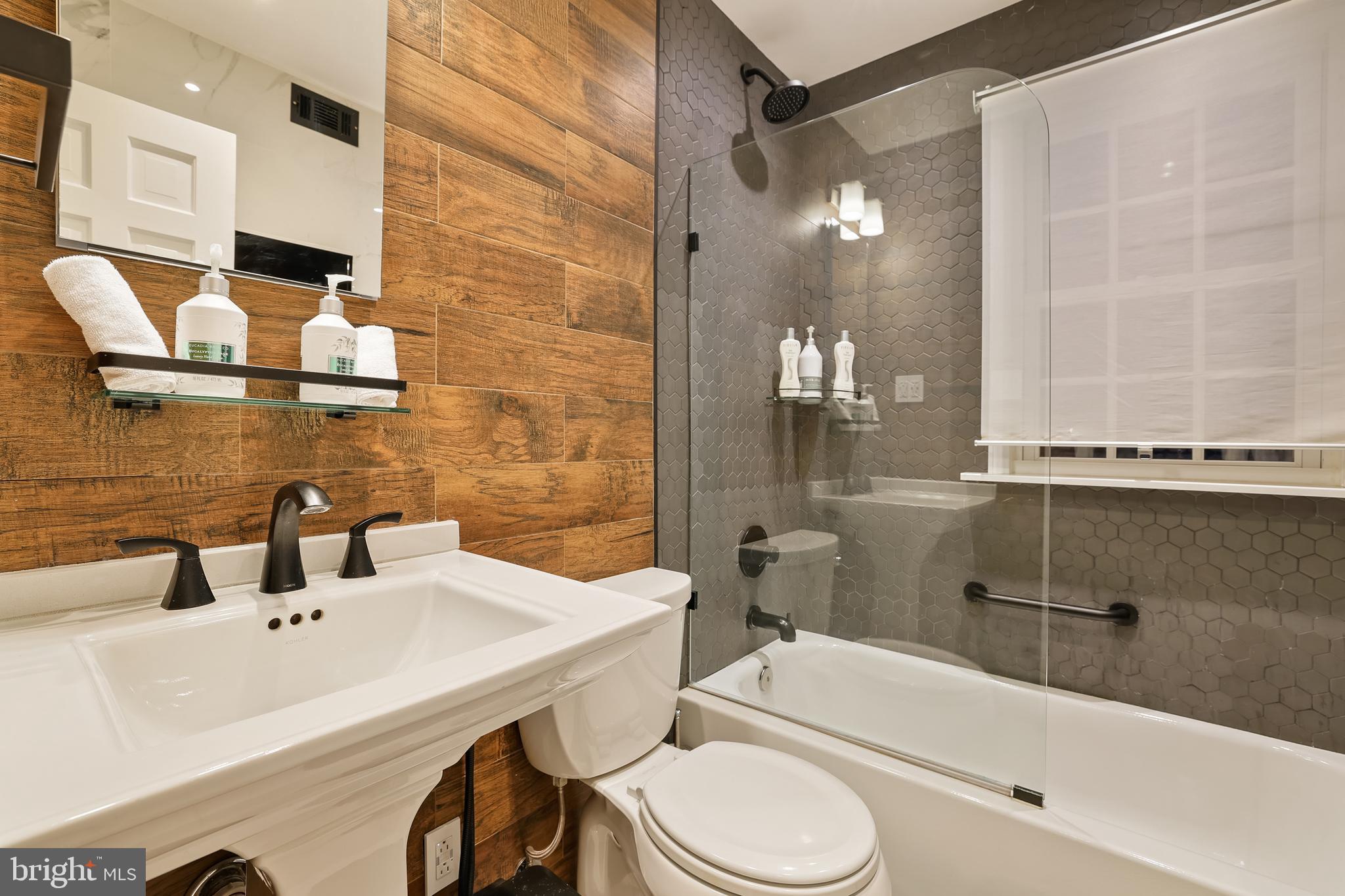1233 Potomac Street Northwest Washington, DC 20007 - Photo 15 of 26 a bathroom with a sink a toilet and shower
