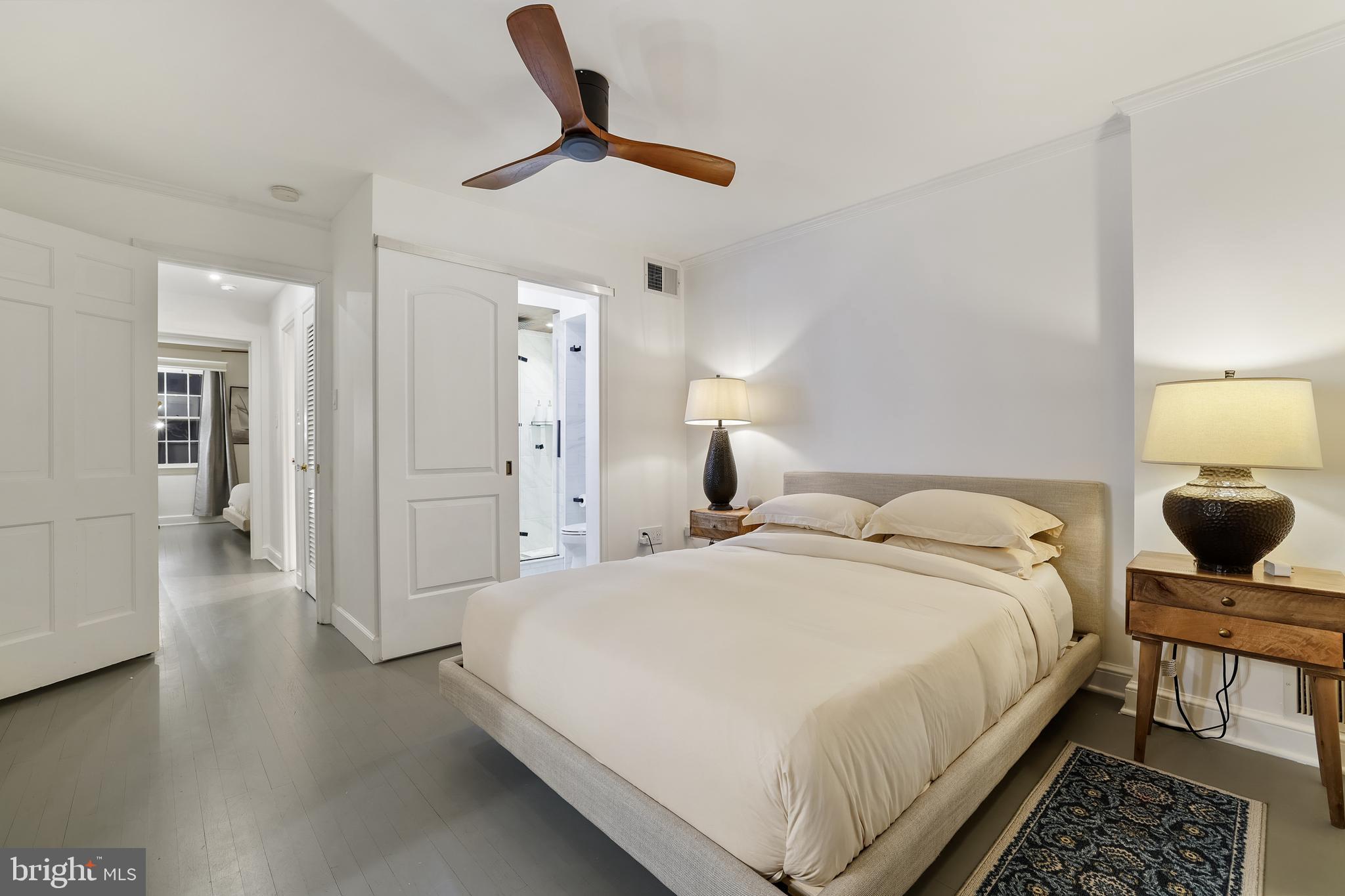 1233 Potomac Street Northwest Washington, DC 20007 - Photo 18 of 26 a bedroom with a bed and a chandelier