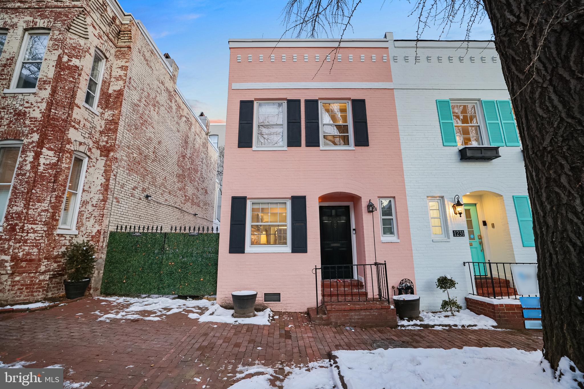 1233 Potomac Street Northwest Washington, DC 20007 - Photo 2 of 26 a front view of a house with a yard