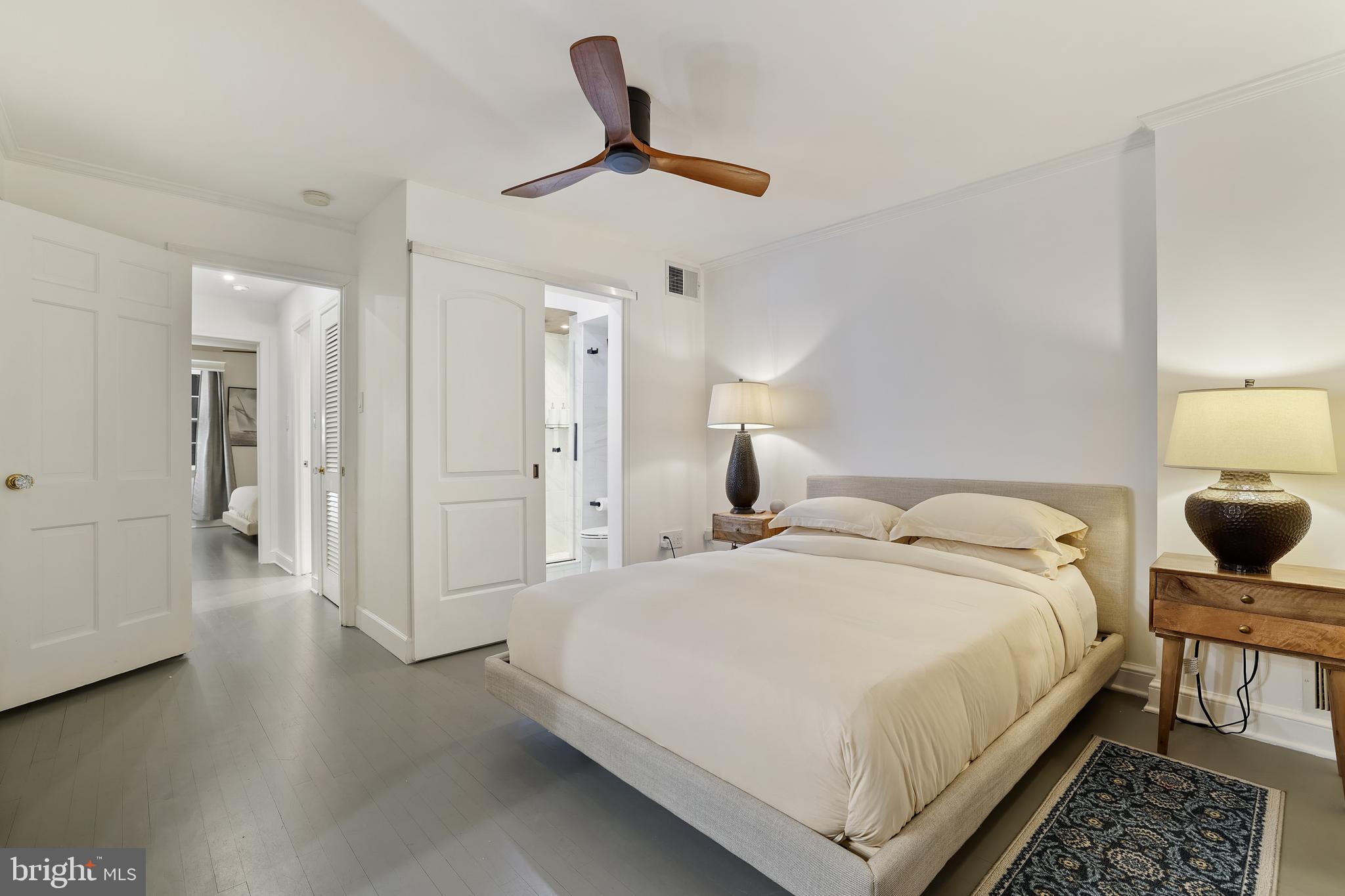 1233 Potomac Street Northwest Washington, DC 20007 - Photo 21 of 26 a bedroom with a bed and a chandelier