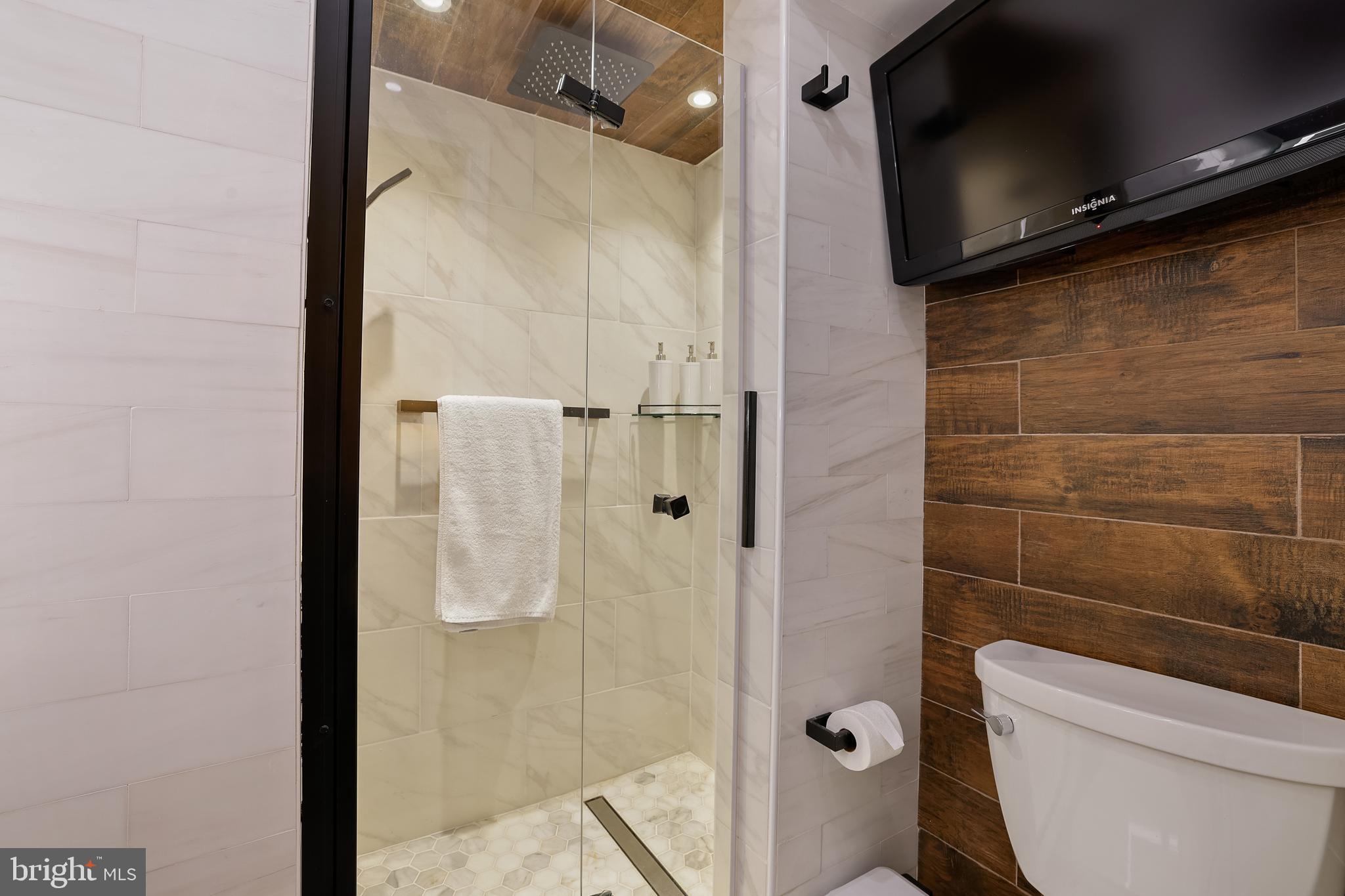 1233 Potomac Street Northwest Washington, DC 20007 - Photo 23 of 26 a bathroom with a shower and a toilet
