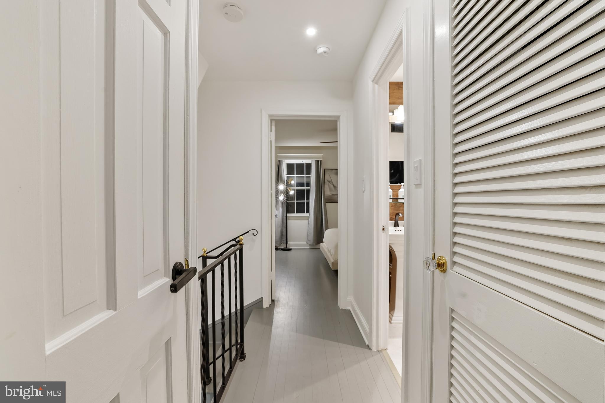1233 Potomac Street Northwest Washington, DC 20007 - Photo 24 of 26 a view of a hallway with wooden floor and staircase