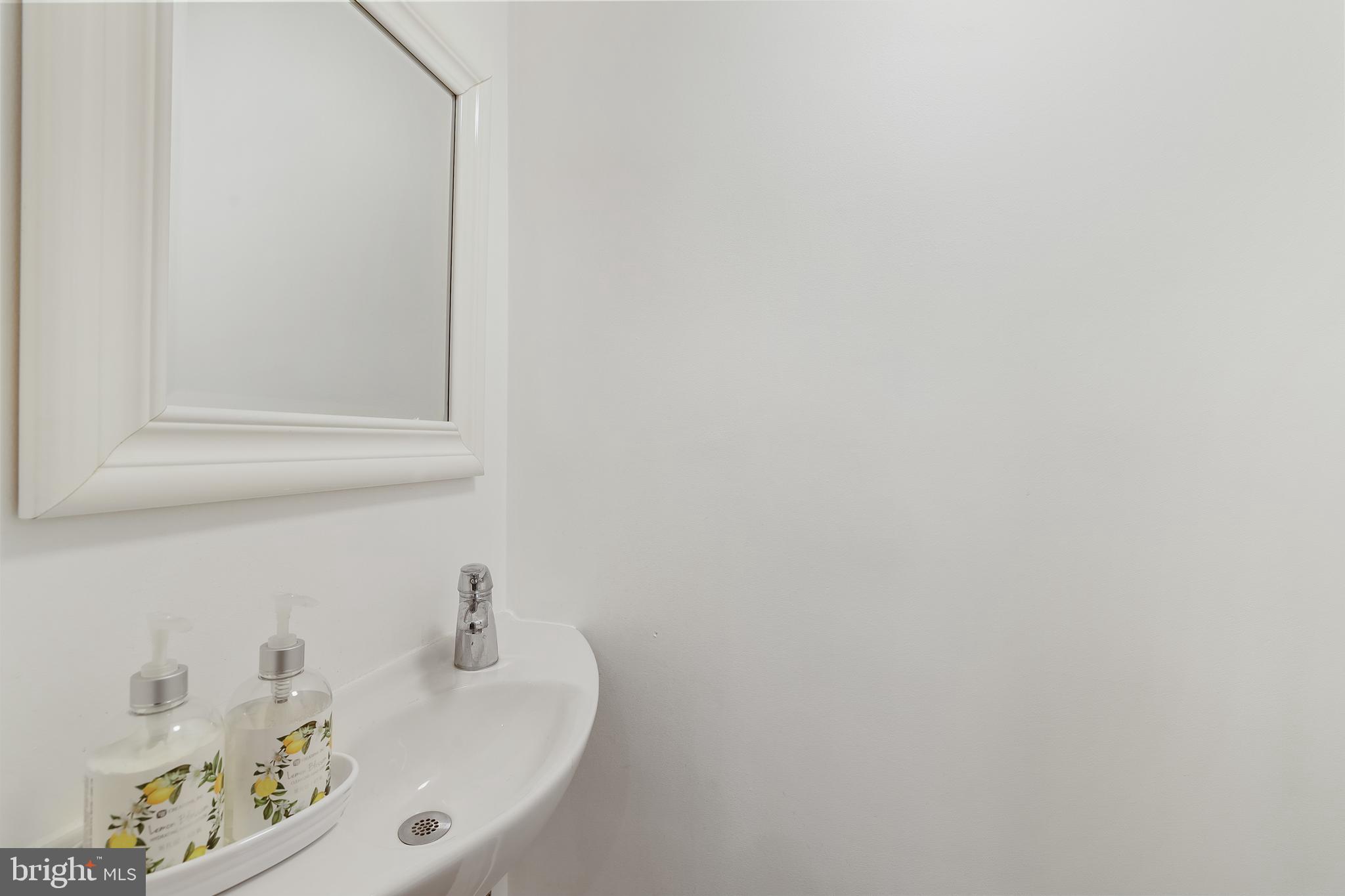 1233 Potomac Street Northwest Washington, DC 20007 - Photo 3 of 26 a bathroom with a sink and a window