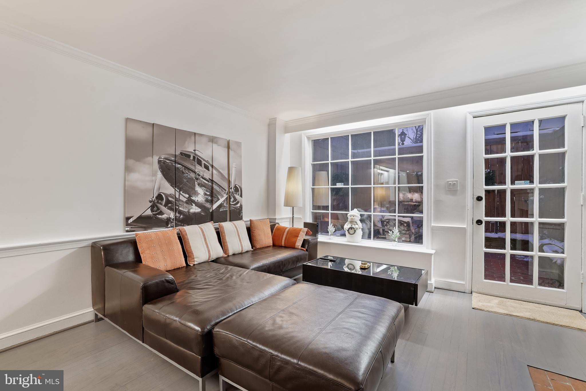 1233 Potomac Street Northwest Washington, DC 20007 - Photo 9 of 26 a living room with furniture and a large window