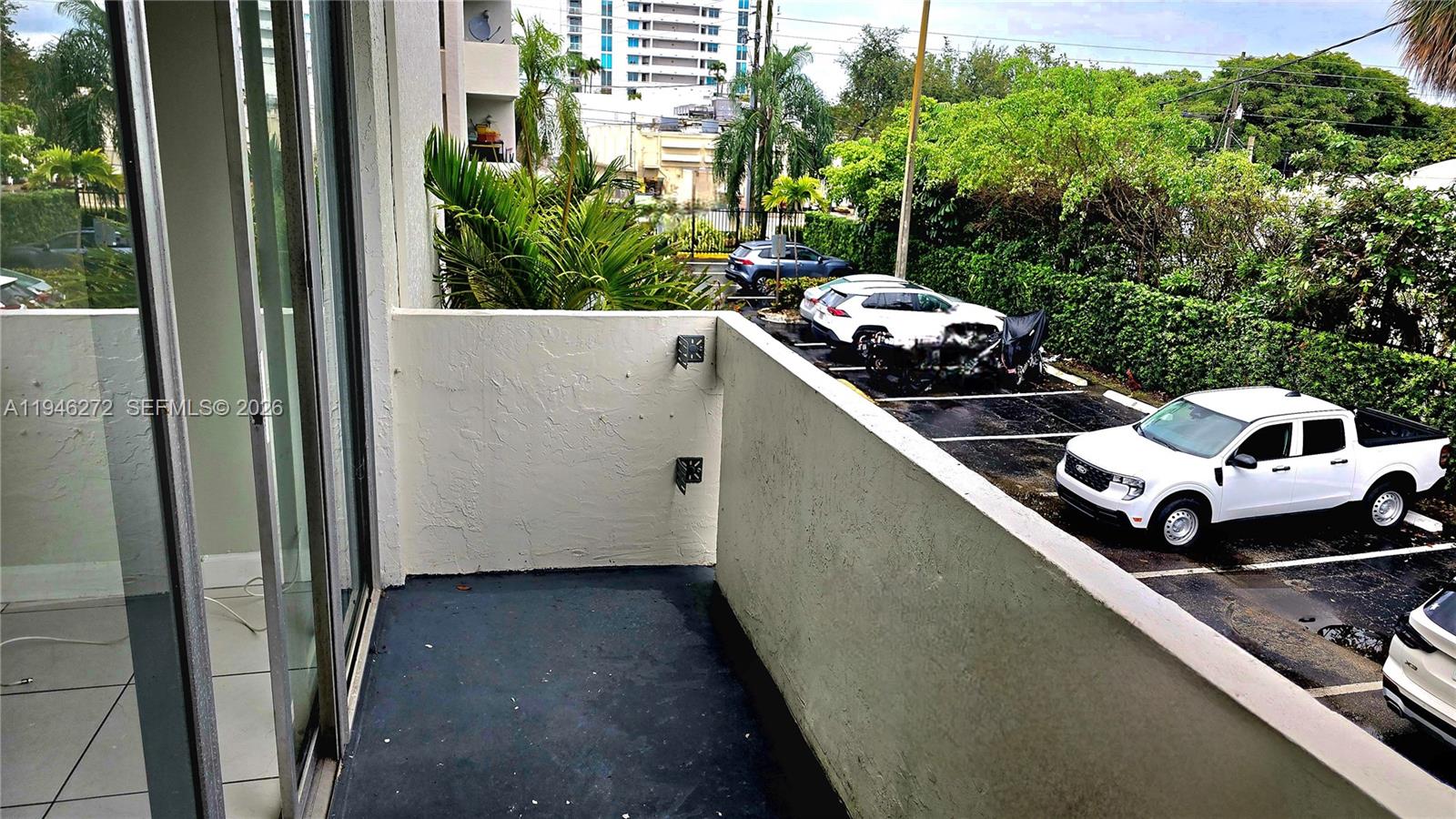 2150 Southwest 16th Avenue, Unit 206 Miami, FL 33145 - Photo 18 of 40 a car parked in front of a house