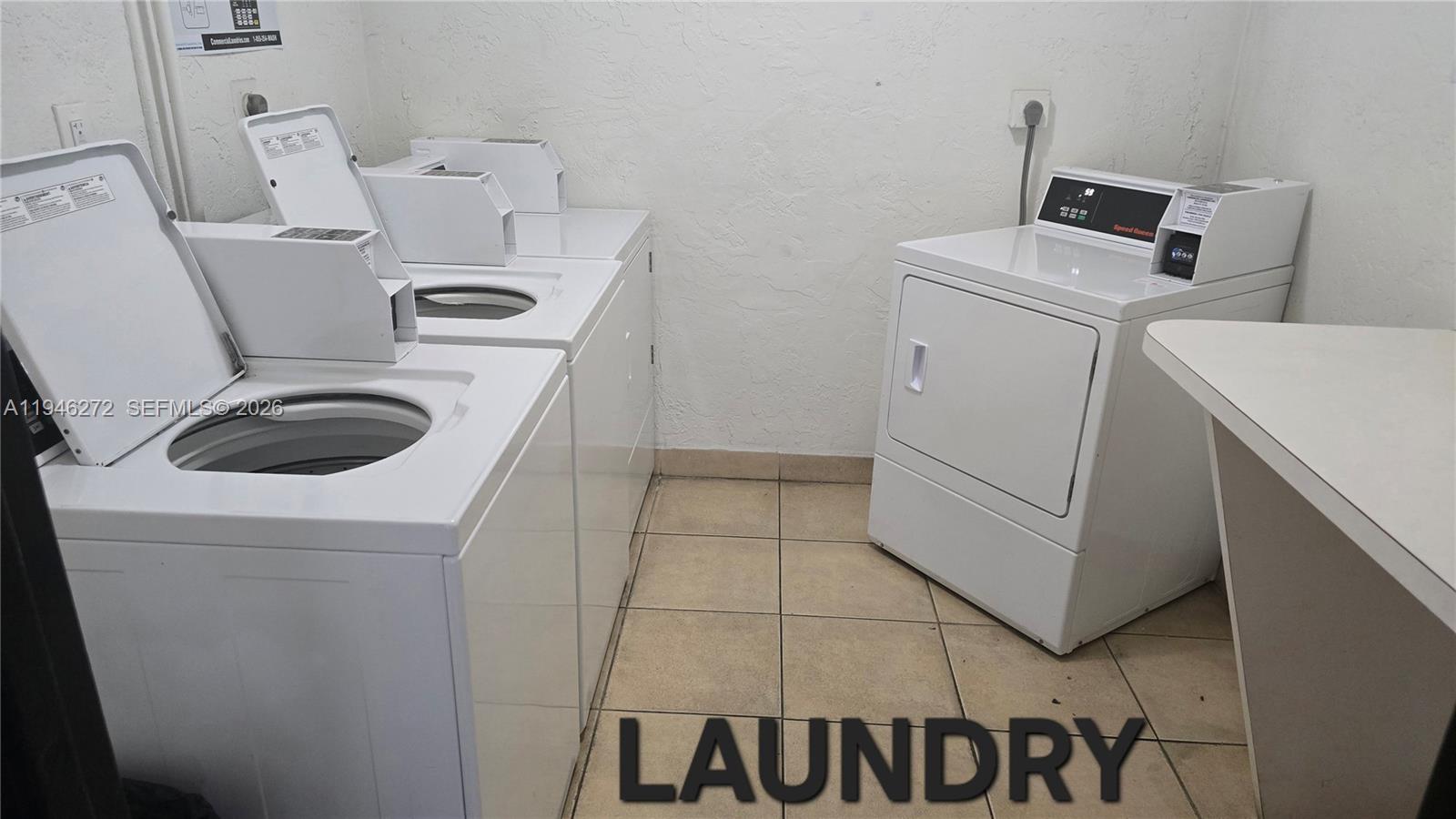 2150 Southwest 16th Avenue, Unit 206 Miami, FL 33145 - Photo 22 of 40 a utility room with dryer and washer