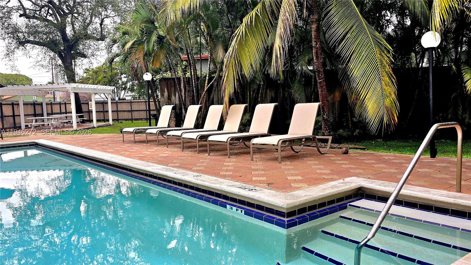 2150 Southwest 16th Avenue, Unit 206 Miami, FL 33145 - Photo 25 of 40 a view of swimming pool with chairs
