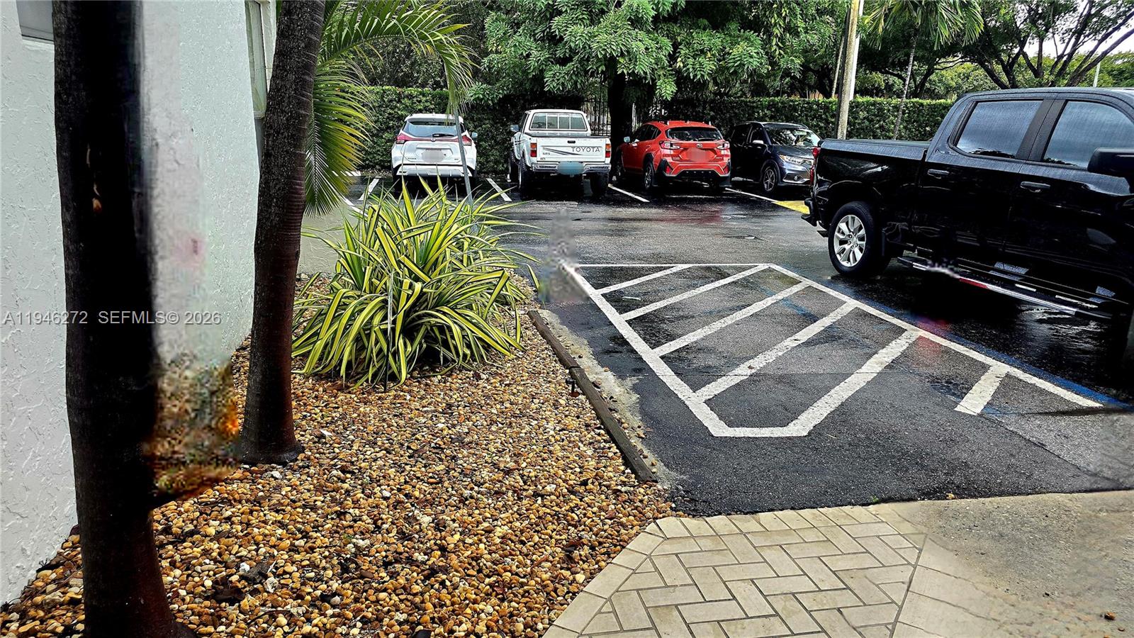 2150 Southwest 16th Avenue, Unit 206 Miami, FL 33145 - Photo 34 of 40 a view of a chairs and table in the backyard