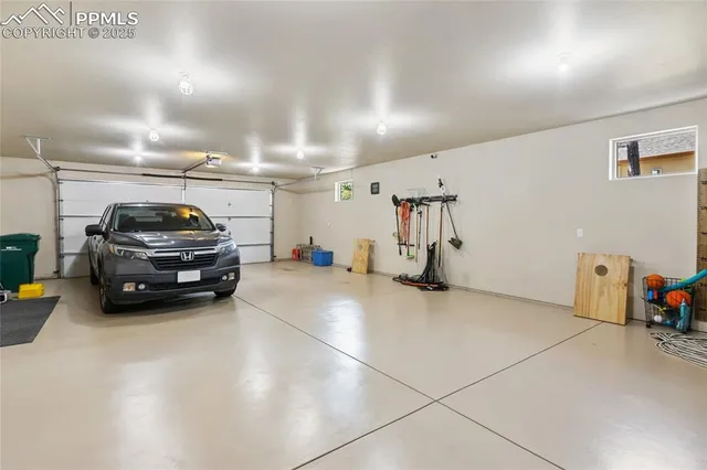 a view of parking garage with cars parked