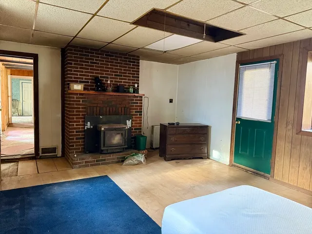 a balcony with wooden fence and trees