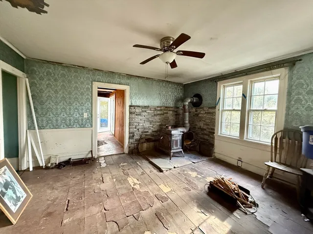 a bedroom with furniture and a window