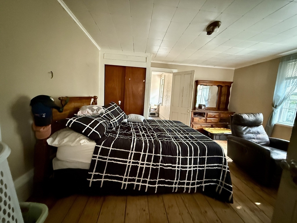11 Danforth Park Road Framingham, MA 01701 - Photo 20 of 33 a bedroom with a bed and wooden floor