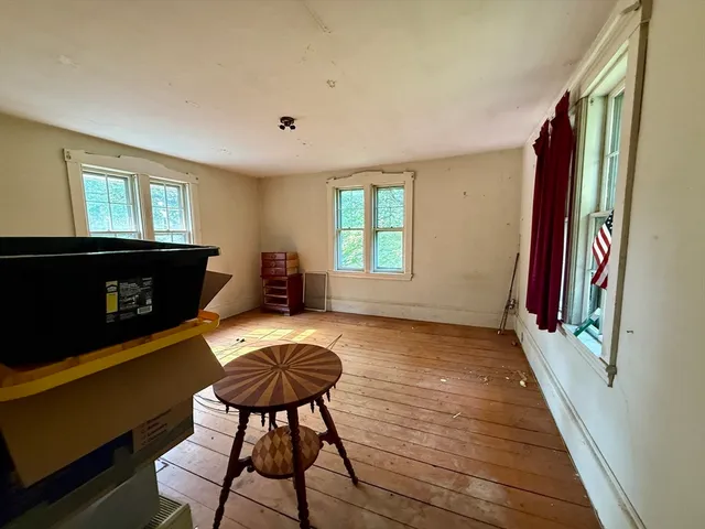 a sign board with yard in front of it