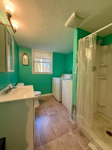 a room that has a sink and a mirror in it