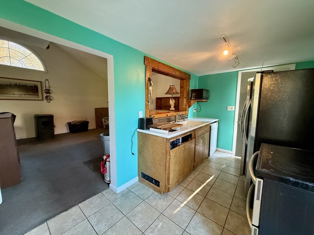 11 Danforth Park Road Framingham, MA 01701 - Photo 6 of 33 a kitchen with stainless steel appliances a stove refrigerator and microwave