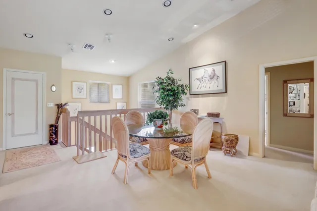 a dining room with furniture and window