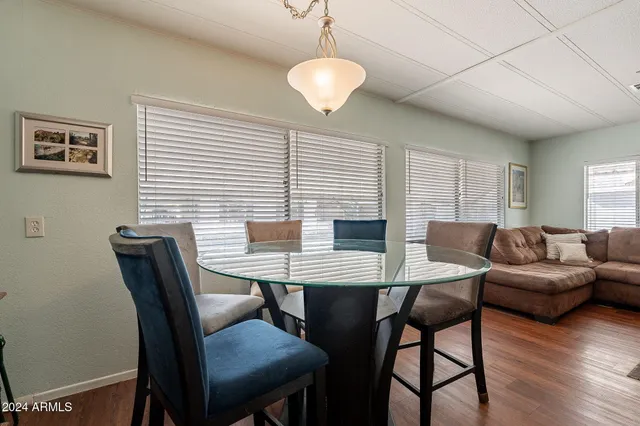 a view of a dining room with furniture window and wooden floor