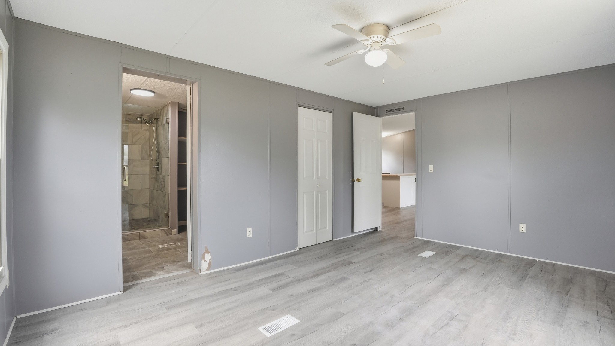 5425 Awalt Road Tullahoma, TN 37388 - Photo 13 of 33 wooden floor in an empty room with a bathroom