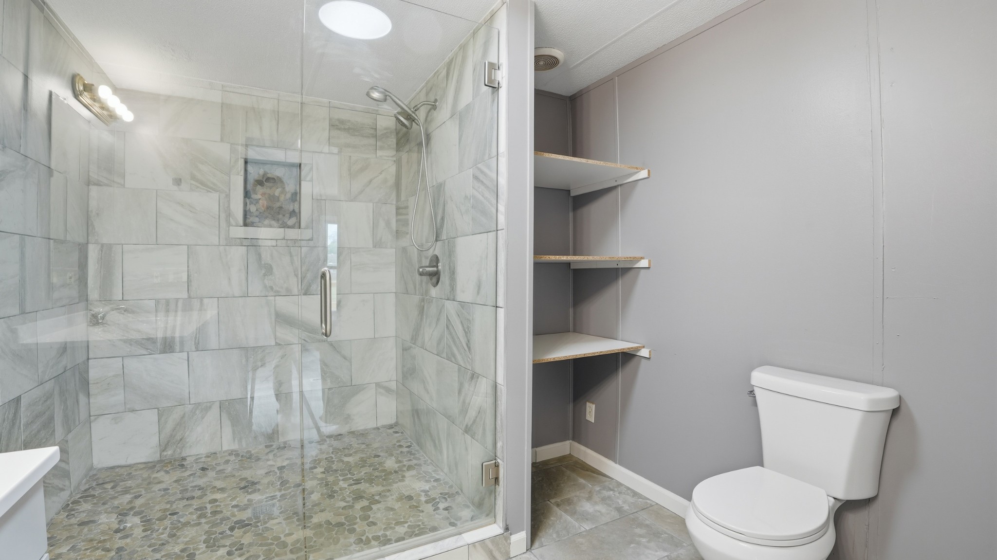 5425 Awalt Road Tullahoma, TN 37388 - Photo 16 of 33 a white toilet next to a bathroom sink