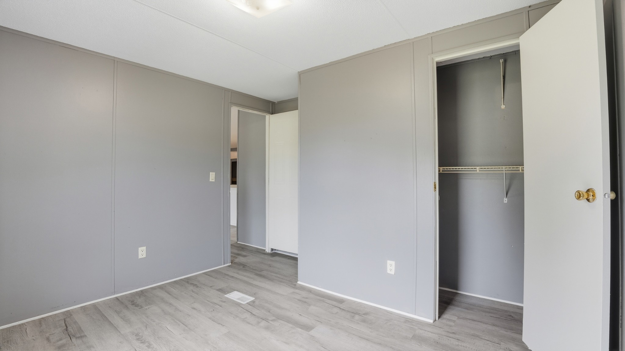 5425 Awalt Road Tullahoma, TN 37388 - Photo 18 of 33 an empty room with wooden floor and closet