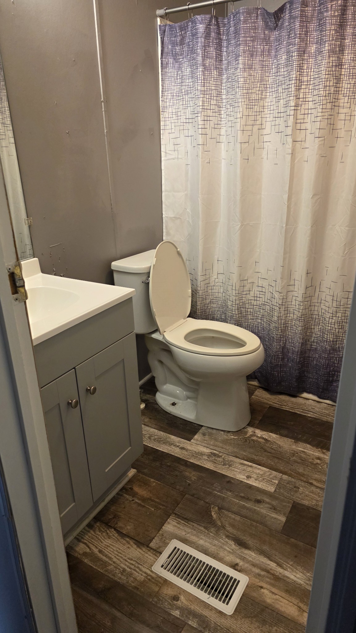 5425 Awalt Road Tullahoma, TN 37388 - Photo 21 of 33 a bathroom with a toilet and a shower curtain