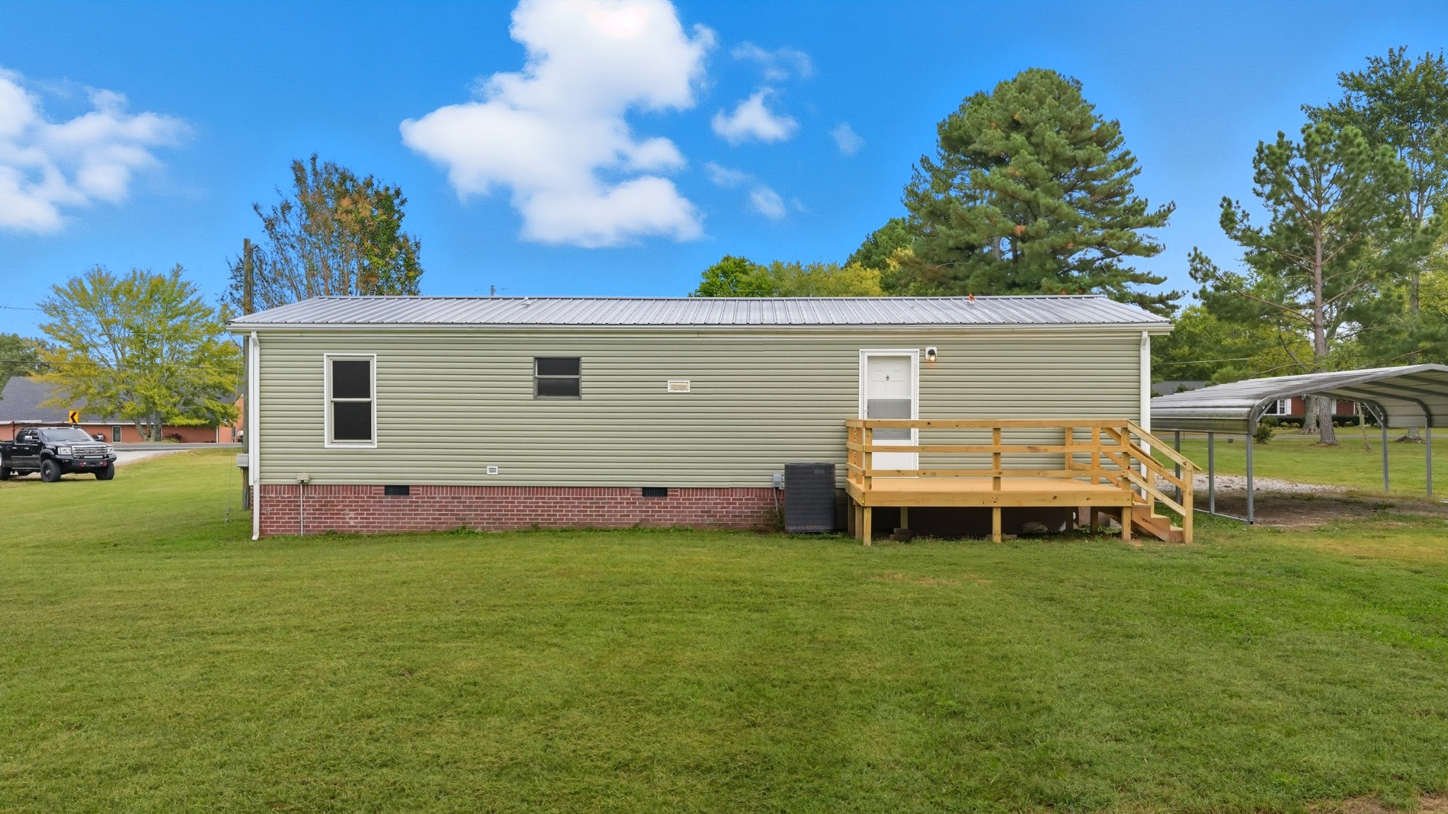 5425 Awalt Road Tullahoma, TN 37388 - Photo 25 of 33 a backyard of a house with table and chairs