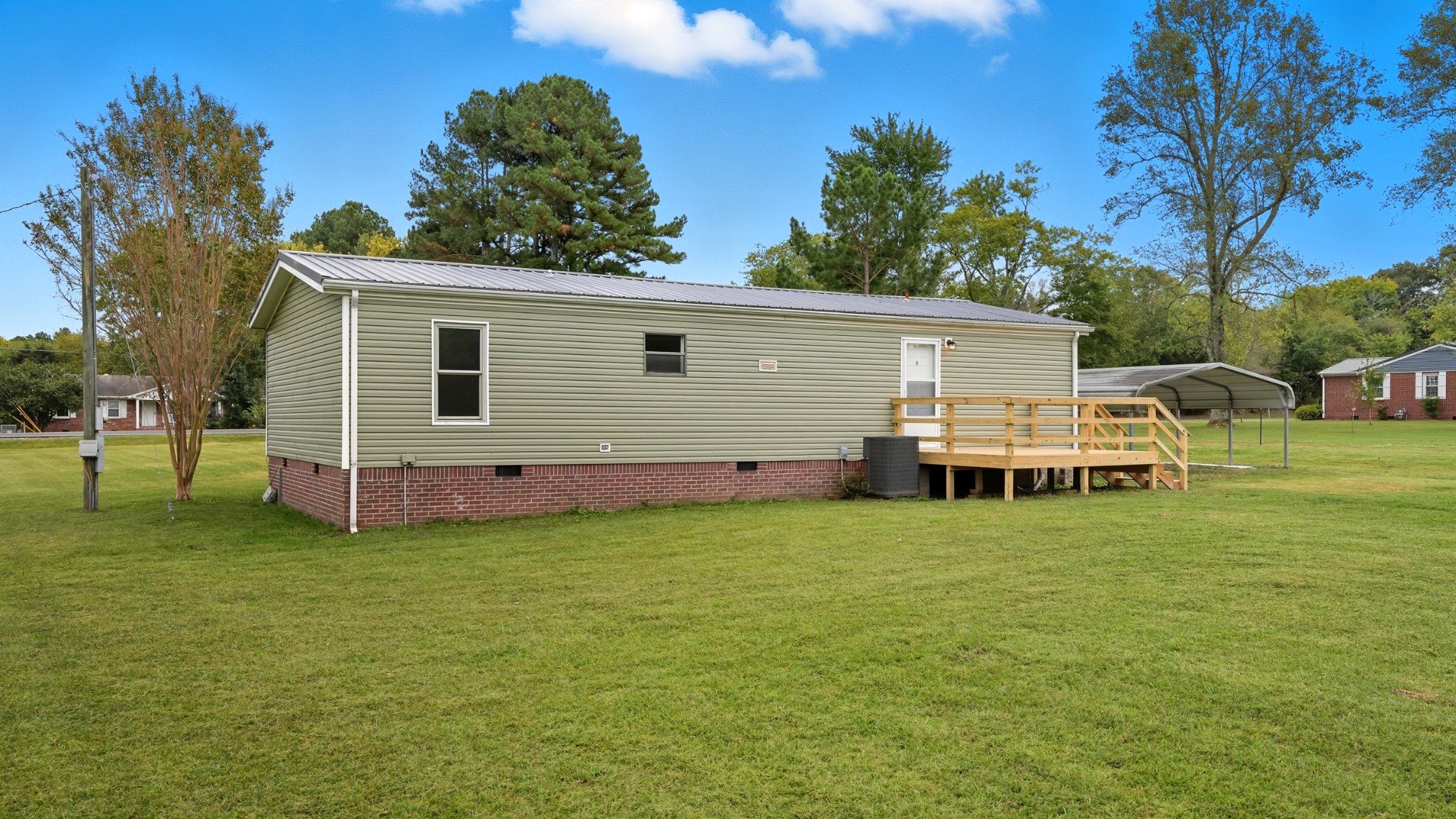 5425 Awalt Road Tullahoma, TN 37388 - Photo 26 of 33 a backyard of a house with table and chairs