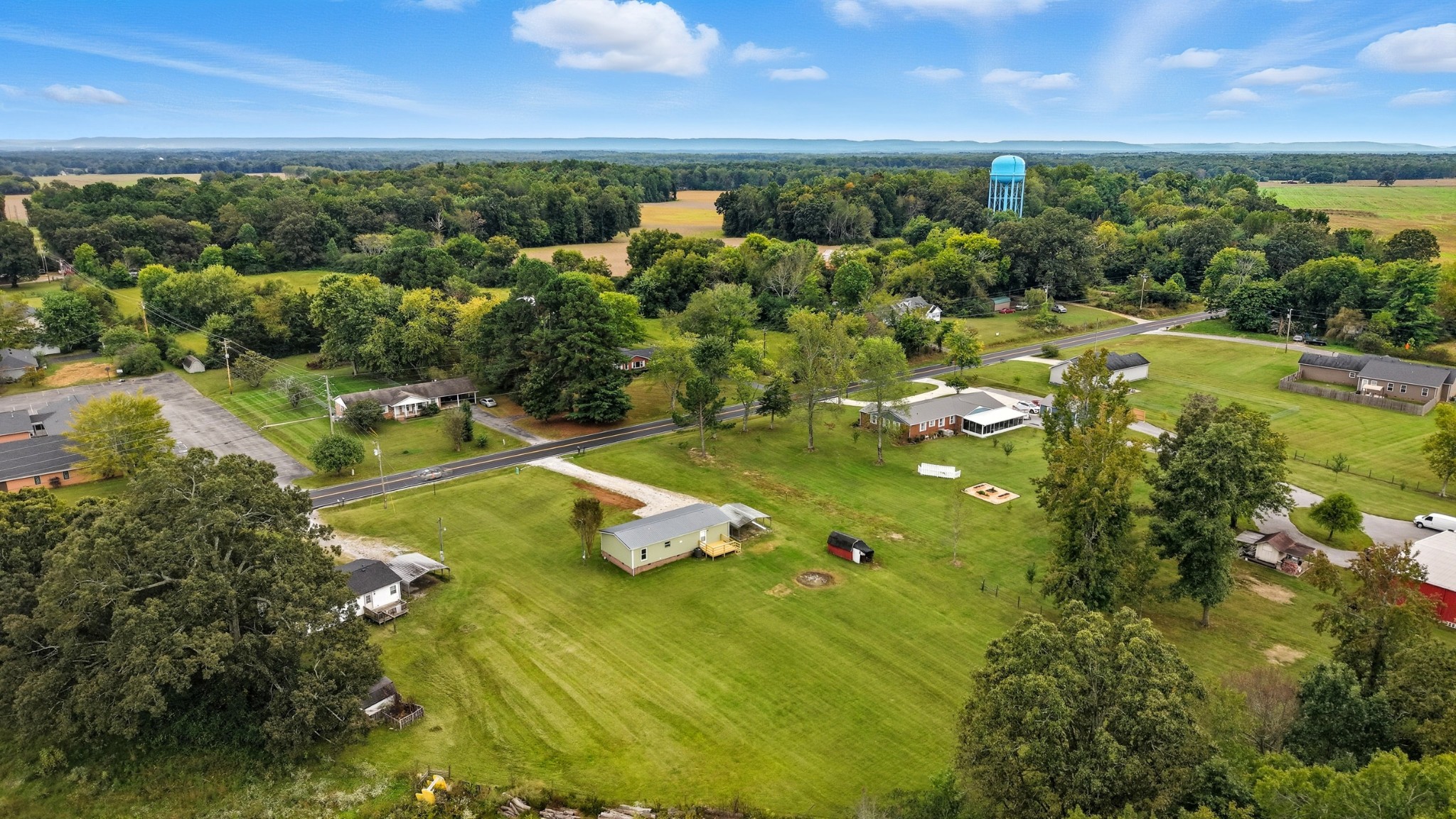 5425 Awalt Road Tullahoma, TN 37388 - Photo 29 of 33 a view of a lake with lawn chairs